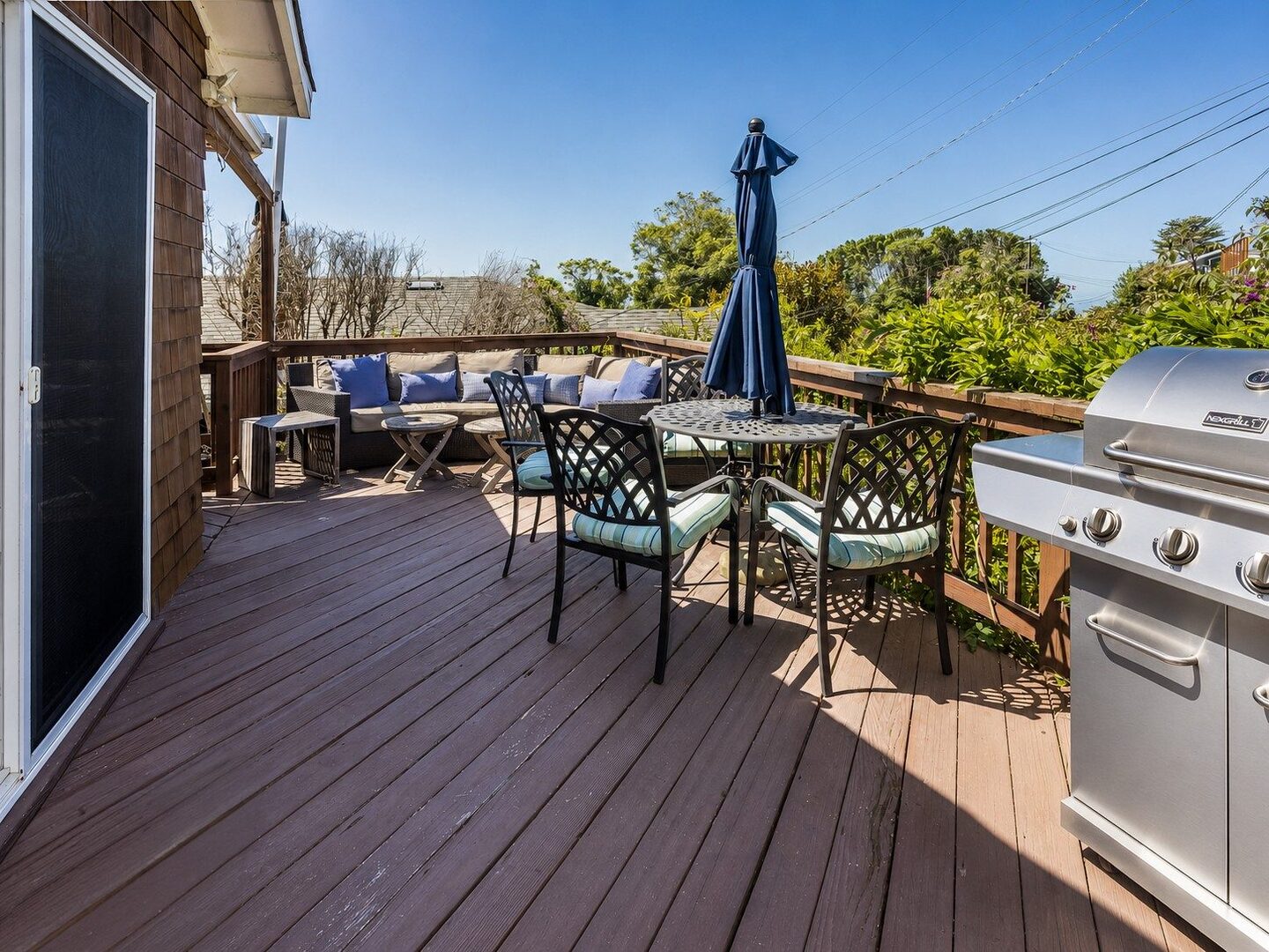 Outdoor deck with lounge seating and grill