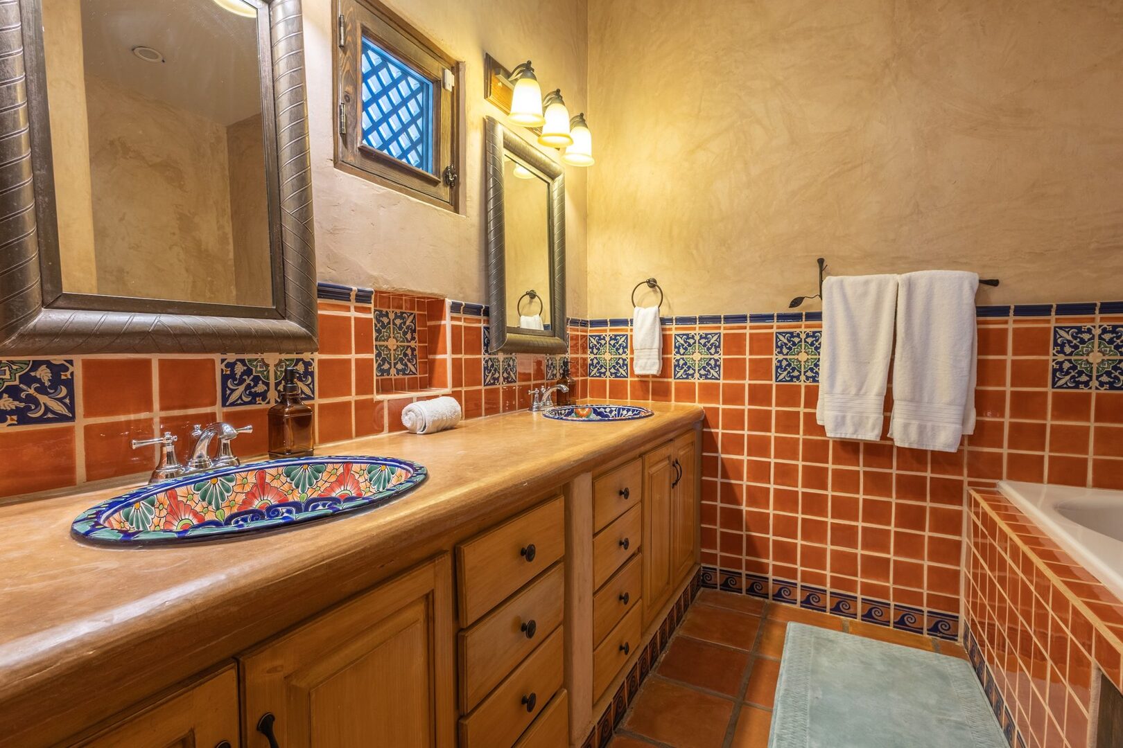 Bathroom with hand-painted Talavera double sinks and soaking tub