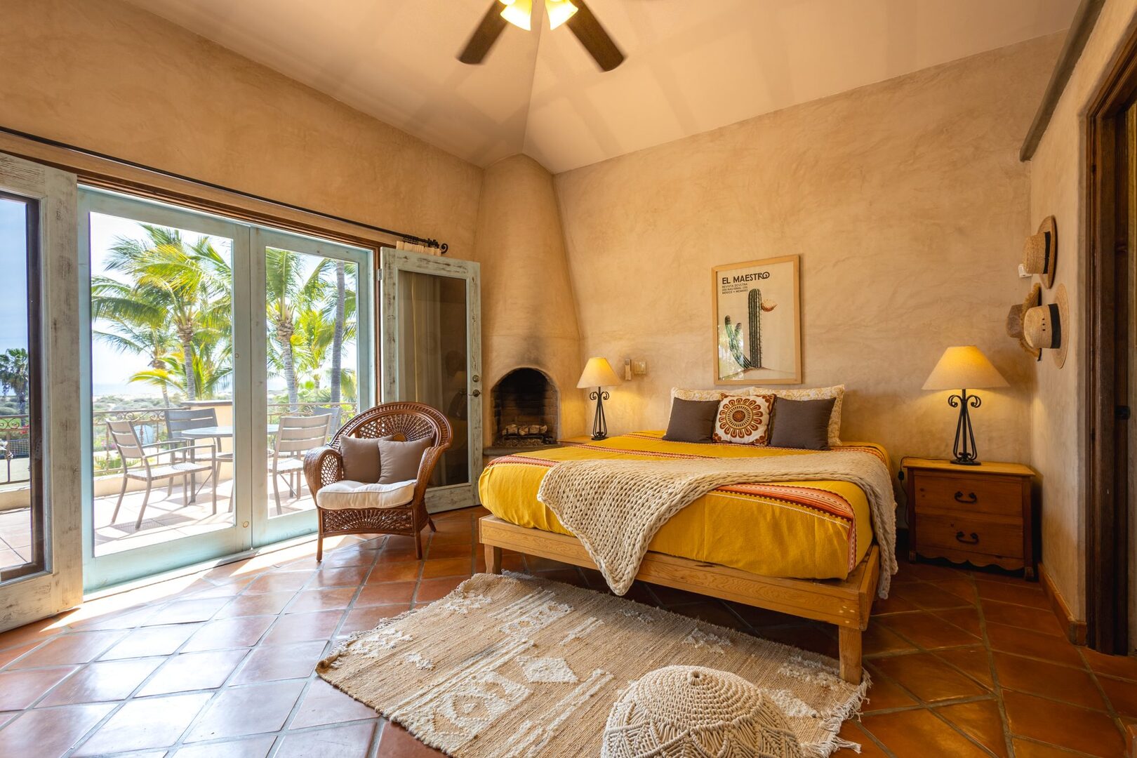 Bedroom with fireplace and private terrace overlooking the ocean
