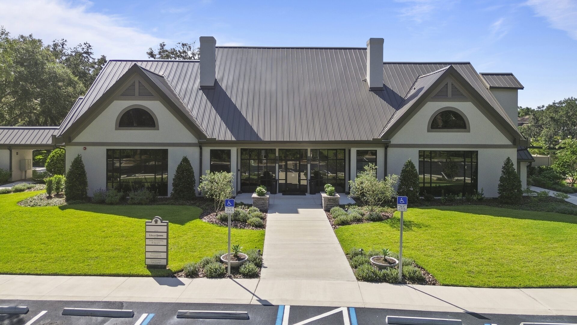 Front entrance of Hunters Green Professional Park with tenant signage